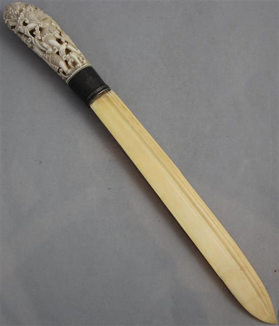 An early 20th century Indonesian ivory and silver mounted paperknife, 16.5in.